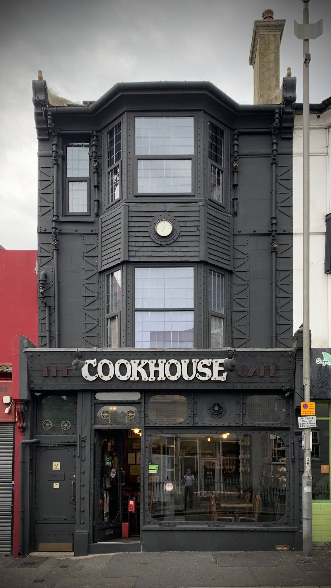 Complete historic Cookhouse building, shop sign, entrance and pavement on Queens Road